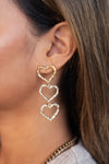 Statement open oorhangers met drie hartjes - Goud